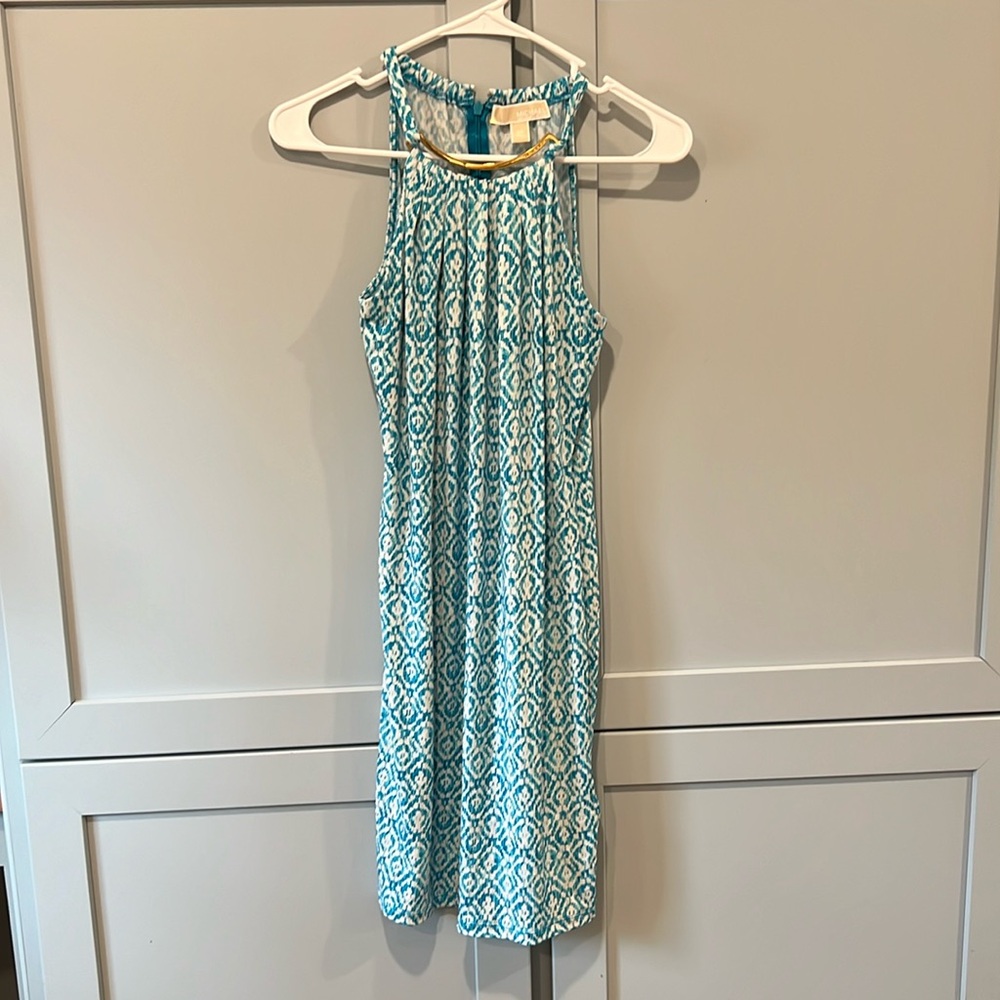 Michael Kors Size XS dress with gold bar feature.